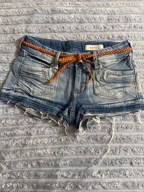 Women's Distressed Blue Denim Cutoff Shorts with Braided Tan Belt